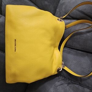 MK bag has never been used but has some details on the strap but has never been